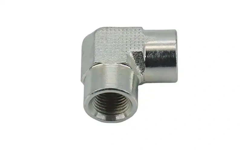 Adaptador hembra NPT de 90° 7N9